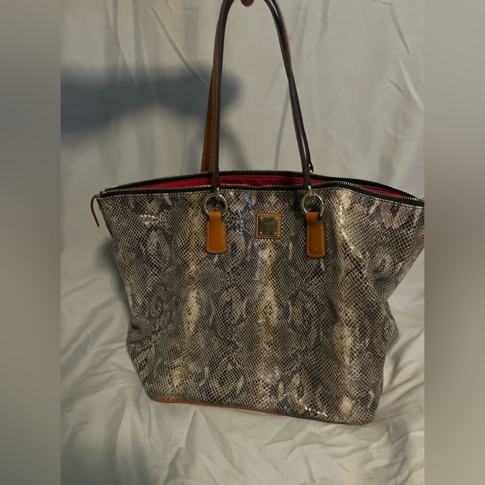 Dooney & Burke Tote. Black. And brown snake skin print.